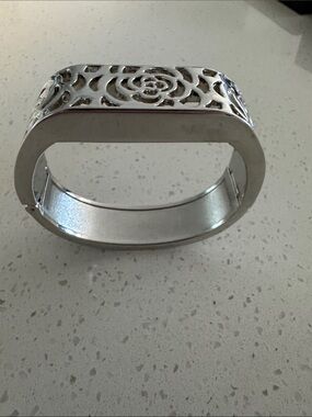 Silver Floral Cutout Hinged Bangle Bracelet designed to hide Fitbit Tracker